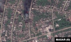 Същият квартал в града, показан в сателитна снимка от 15 май 2023 г.