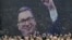 Pristalice Srpske napredne stranke ispred ogromnog transparenta sa likom predsednika Srbije Aleksandra Vučića tokom političkog mitinga Srpske napredne stranke (SNS) u Štark areni u Beogradu 2. decembra 2023.