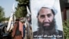 Poster talibanskog vrhovnog vođe Hibatulaha Ahundžade uz cestu u Kabulu 14. 8. 2023.