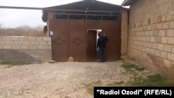 The gate to Saidakram Rajabalizoda's family home in Chamanzor village in Tajkistan.