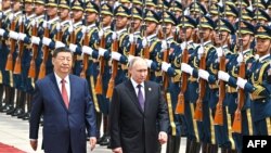 Рускиот претседател Владимир Путин и кинескиот лидер Си Џинпинг за време на официјалната церемонија за пречек во Пекинг, мај 2024
