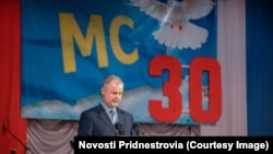 Aleksandr Andreev înfățișat într-o fotografie a partalului Novosti Pridnestrovia, vorbind la o ceremonie a militarilor ruși de menținere a păcii, la Tiraspol, pe 29 iulie 2022, în calitate de co-președinte din partea Rusiei al Comisiei Unificate de Control.