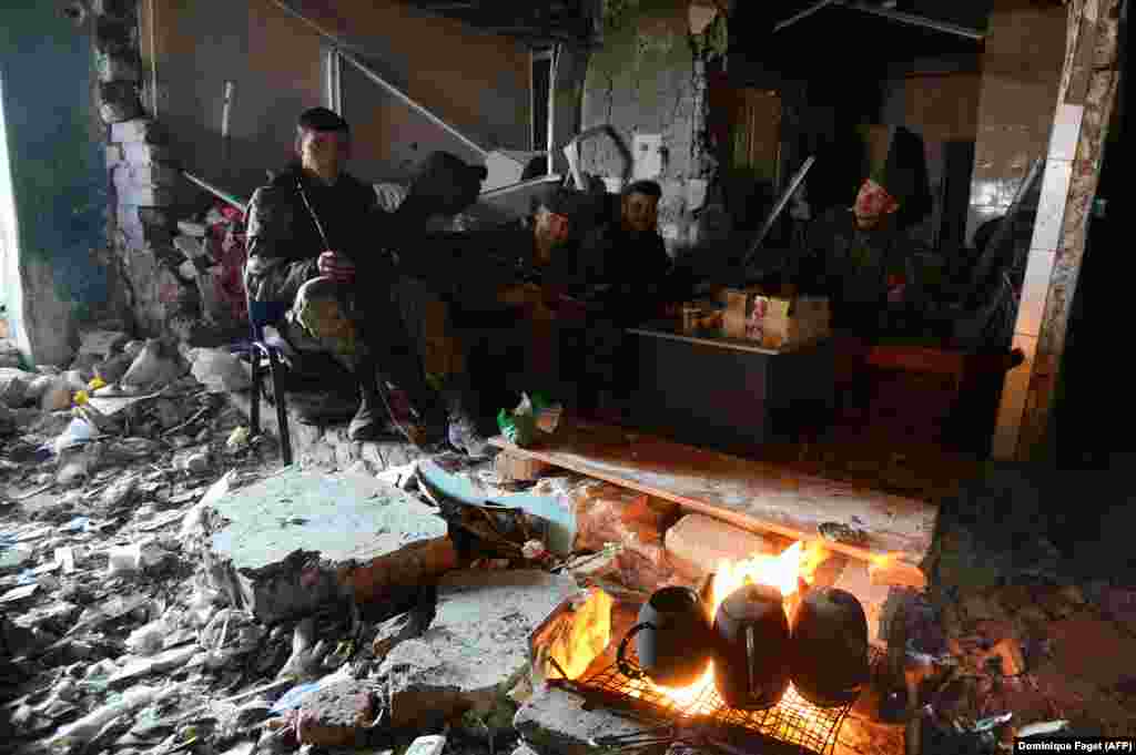 Russian-backed separatists are seen inside the remains of the Donetsk airport amid the second battle for the airport in October 2014. In September 2014, separatist forces launched an attack on Ukrainian troops holed up inside the facility. The airport was the only remaining foothold Kyiv had in Donetsk after the eastern city had been taken over by pro-Kremlin forces. &nbsp;