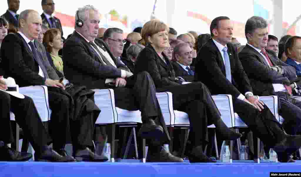 Komemoraciji 2014. prisustvovali su ruski predsjednik Vladimir Putin (lijevo), češki predsjednik Miloš Zeman (drugi slijeva), njemačka kancelarka Angela Merkel (u sredini), australski premijer Tony Abbott (drugi zdesna) i novoizabrani predsjednik Ukrajine Petro Porošenko.