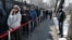 Граждане России стоят в очереди у генерального консульства, чтобы принять участие в выборах президента России. Алматы, 17 марта 2024 года