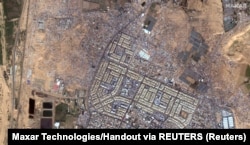 Satelitski snimak na kojem se vide šatori raseljenih Palestinaca u pograničnom gradu Rafa na jugu Pojasa Gaze, 7. februar 2024.