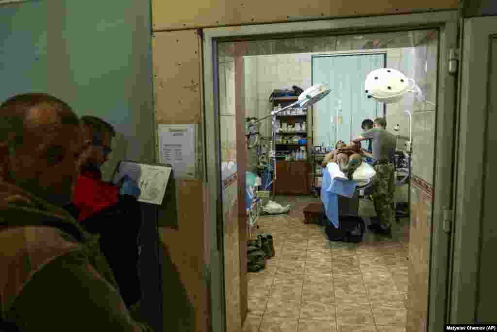 A Ukrainian soldier receives treatment at a field hospital near Bakhmut on September 10.&nbsp; Bakhmut fell to Russia in May, largely due to waves of attacks from&nbsp;mercenary Wagner fighters,&nbsp;including prison conscripts, thought to have died by the hundreds. Ukraine has been trying to reclaim it ever since, hoping to inflict a major psychological blow to Russia.