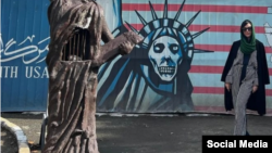 American porn star Whitney Wright poses in front of the former U.S. Embassy in Tehran.