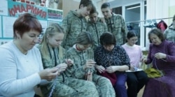 Students from School No. 8 in the city of Mozhga and their mothers and grandmothers knit stockings for soldiers with amputated limbs.
