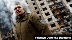 Kyiv Mayor Vitali Klitschko visits the site of a residential building heavily damaged by a Russian missile attack in Kyiv on January 2.