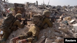 Израелски военни сред разрушения в Ивицата Газа, 26 февруари 2024 г.