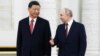Președintele rus Vladimir Putin (dreapta), cu omologul său chinez, Xi Jinping, la Moscova, anul trecut. 