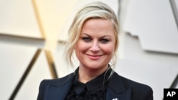 Ейми Поулър пристига на церемонията по връчването на Оскарите, 24 февруари 2019 г., Лос Анджелис. 