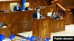 Proiectul de lege privind crearea PACCO este prezentat de la tribuna Parlamentului de deputatul PAS, Igor Chiriac, 20 februarie 2025.