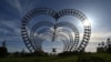UKRAINE -- A child swings on a heart-shaped swing in a park outside Kyiv on April 29, 2024, 