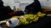 An Afghan boy receives treatment at a hospital after an airstrike in the southern province of Helmand on November 28.