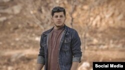 تصویر منتشر شده از برهان الیاسی در شبکه‌های اجتماعی، جوان ۲۲ ساله اهل جوانرود که روز شنبه ۱۰ دی با شلیکم مستقیم نیروهای امنیتی کشته شد