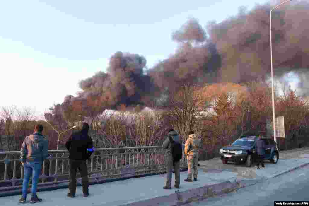 Smoke rises from an explosion in Lviv in western Ukraine on the morning of March 18 after several missiles struck an aircraft repair plant in the city, bringing the war closer to its historic, art-filled center. &nbsp;