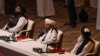 Members of the Taliban delegation attend the opening session of the peace talks with the Afghan government in Doha on September 12.
