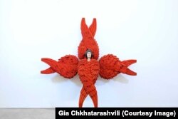 გიორგი ხანიაშვილის ქერუბიმი ფრთებზე თვალებით; ხის სკულპტურა. ეკუთვნის ათინათის კერძო კოლექციას.