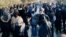 A large crowd of protesters reached Hamidreza Rouhi's grave in a Tehran cemetery, despite the deployment of security forces to keep crowds away.