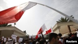 Protesters block the entrances to the upper house of Bahrain's National Assembly in Manama on February 28.