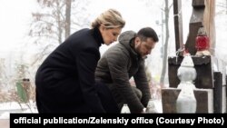 UKRAINE - Volodymyr Zelenskiy with his wife Olena Zelenska near the monument to the victims in Kyiv. Nebesna sotnya