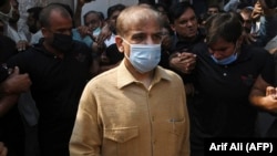Pakistani opposition leader Shahbaz Sharif leaves the High Court in Lahore on September 24.