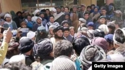 Mehdi Mujahed (center) surrounded by supporters in Balkhab.