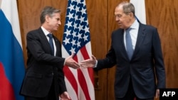 U.S. Secretary of State Antony Blinken (left) greets Russian Foreign Minister Sergei Lavrov before their meeting in Geneva on January 21.