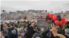 Videos published on social networks showed a large gathering at the grave of Abdullahi with people chanting "The martyr never dies!" and "Death to the dictator!," a reference to Iranian Supreme Leader Ayatollah Ali Khamenei, on January 17.