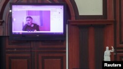 Bivši predsjednik Gruzije Mihail Sakašvili na video snimku tokom ročišta na kojem se razmatralo njegovo prijevremeno puštanje, decembar 2022. 