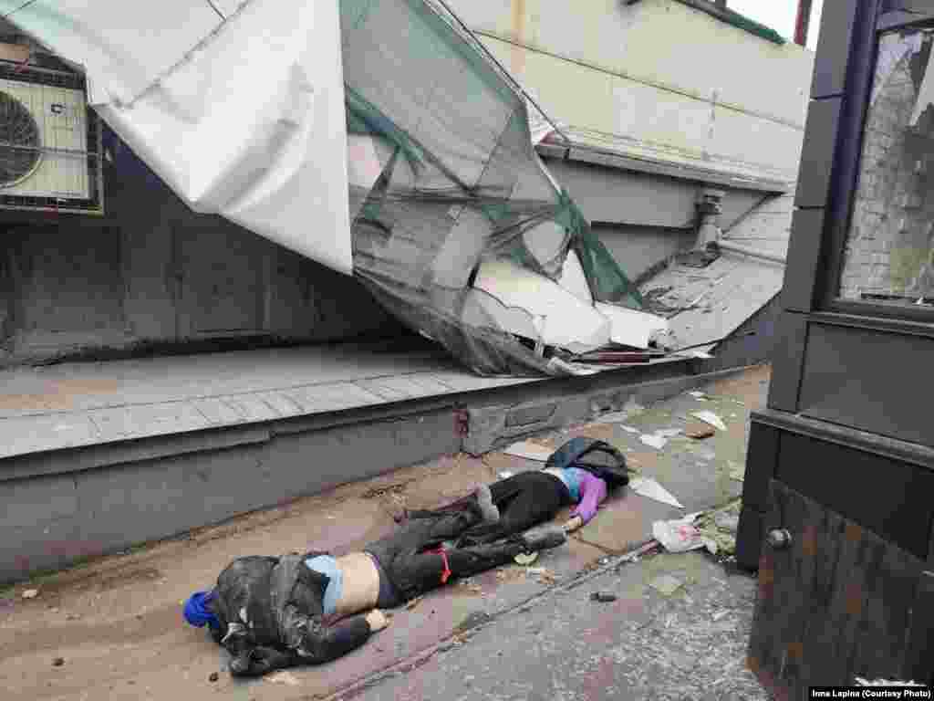 Dead civilians on the ground next to a destroyed building in Mariupol. Mariupol&#39;s deputy mayor, Sergei Orlov, said on March 9 that around 1,200 civilians have died in the city since the Russian invasion began on February 24.