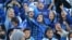 Female fans of Iran's Esteghlal football club cheer during a match between Esteghlal and Mes-e Kerman at Azadi Stadium in Tehran on August 25. It was the first time Iranian women were allowed to attend a national football championship match since the 1979 Islamic Revolution.
