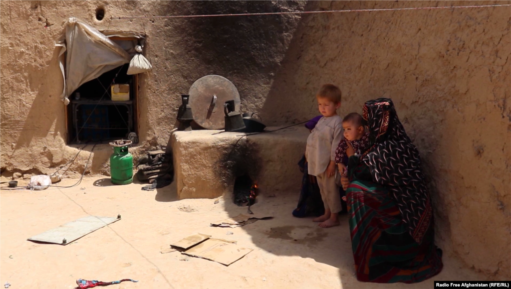 Shukrullah&rsquo;s son and wife in their rented house in Jawzjan&rsquo;s capital, Sheberghan