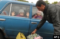 Copii evacuați cu forța din Harkov ajung la o tabără din Belgorod, Rusia. 14 septembrie 2022.