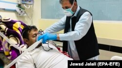 A patient who is infected with COVID-19 receives medical care at a hospital in Kabul on June 1.