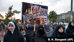 Pakistani Shi'ite Muslims demonstrate over the U.S. air strike in Iraq that killed General Qasim Soleimani, in Islamabad, on January 3.