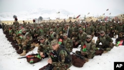 FILE: Afghan Army commandos attend their graduation ceremony after a training program at the Commando Training Center, on the outskirts of Kabul in January.