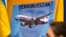 Плакат учасників акції протесту в столиці Австралії, 19 липня 2014 року