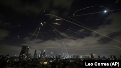 Israeli air defenses fire to intercept missiles during an Iranian attack over Tel Aviv on June 15
