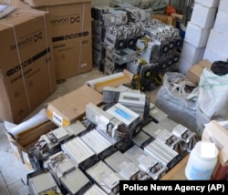 A photo provided by the Iranian police shows boxes of machinery used in Bitcoin mining operations that were confiscated by the authorities in Nazarabad.