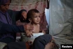 Iman fürdeti Udayt 2025. szeptember 13-án a menekülttáborban