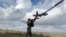 Ukrainian serviceman launches a reconnaissance drone near the frontline town of Pokrovsk