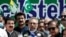 Pakistani President Arif Alvi (C) speaks, along with other leaders, during a rally organized to show their solidarity with people of Indian-administered Kashmir, on a street in Islamabad on August 5.