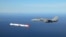US -- A Tactical "Tomahawk" Block IV cruise missile is escorted by a Navy F-14 
