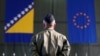 Bosnia-Herzegovina -- A member of European Forces (EUFOR) stands in front of the Bosnia and Herzegovina and European Union flags during Change of Command Ceremony in Sarajevo, March 28, 2017