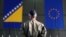 Bosnia-Herzegovina -- A member of European Forces (EUFOR) stands in front of the Bosnia and Herzegovina and European Union flags during Change of Command Ceremony in Sarajevo, March 28, 2017