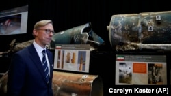Brian Hook, U.S. special representative for Iran, walks past fragments of Iranian short-range ballistic missiles at a base in Washington, D.C., on November 29.