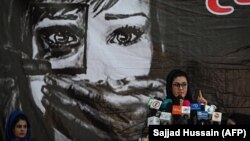 A social worker addresses a gathering of Afghan women at a hall in Kabul on August 2 amid spiking violence by the Taliban.